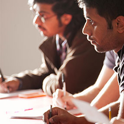 Department of Civil and environmental engineering students sitting together at a table, collaborating and discussing various topics