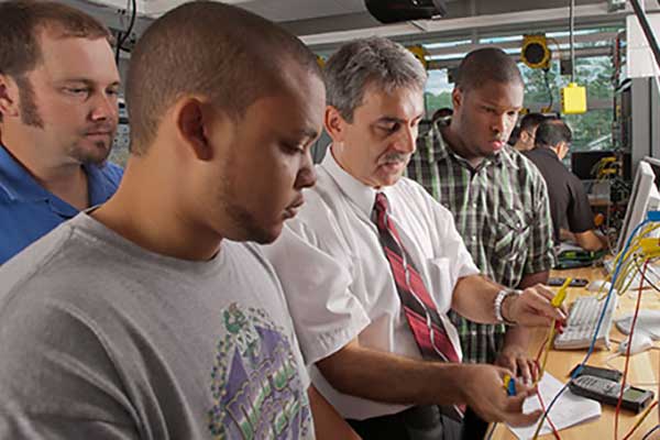 students in lab with professor