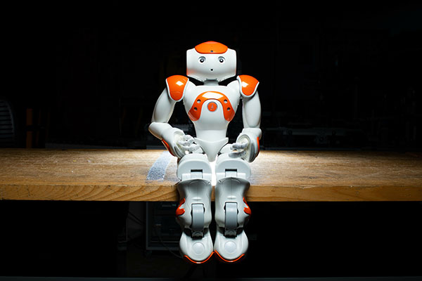 robot seated on desk