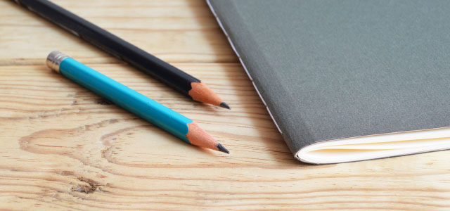 notebook and pencils