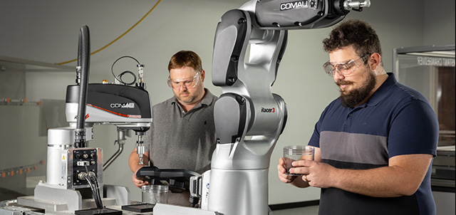 two men working in a robotics lab