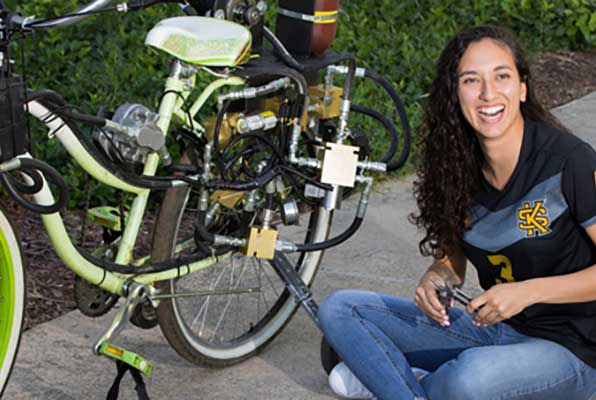 student with fluid ran bicycle