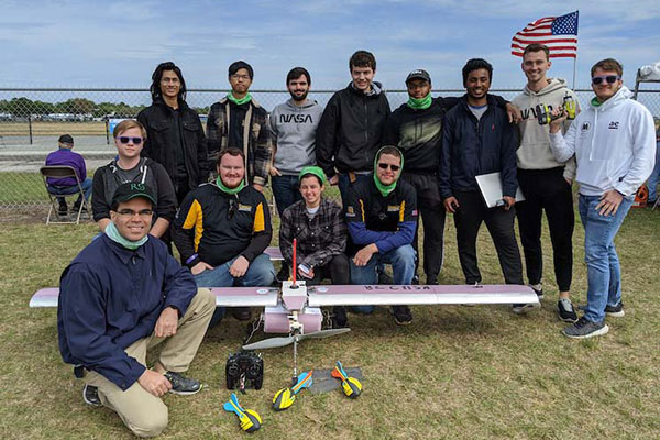 ksu aerospace engineering students with model plane