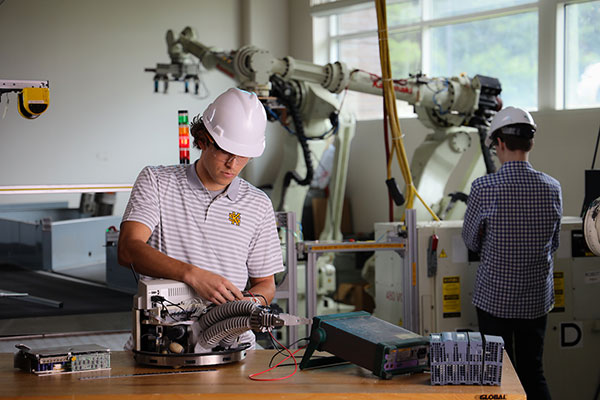 mechanical engineering technology student in lab