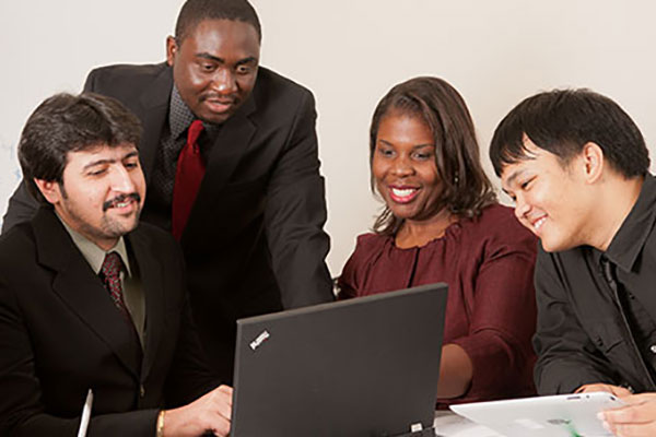 engineering management students at computer