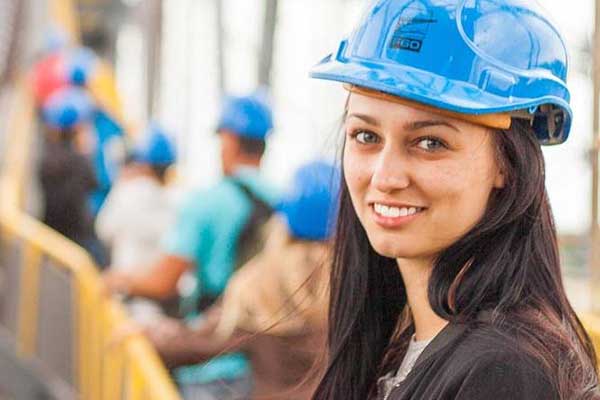 girl in hard hat visiting site