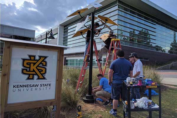 students working on solar panels