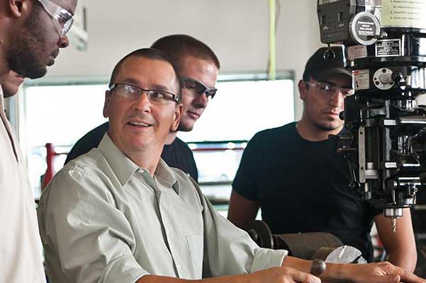 students and professor at a drill