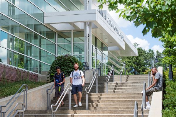 Three KSU students outside on the stairs of the Engineering Technology Center