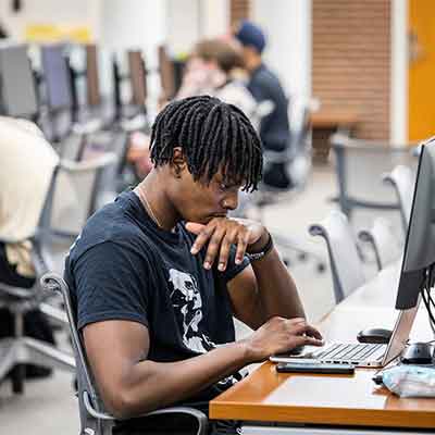 KSU student using their laptop.