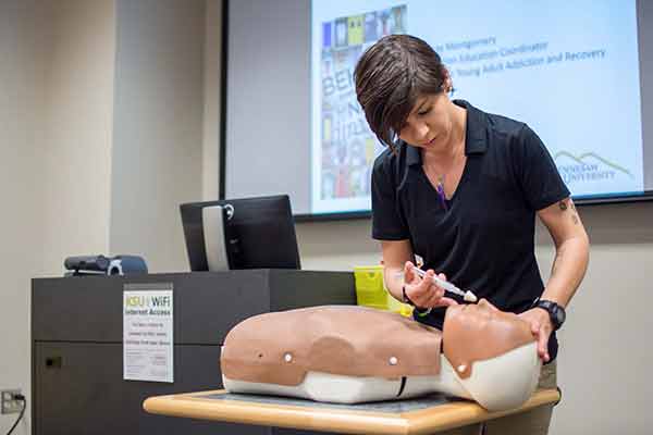 ksu student training with medical dummy