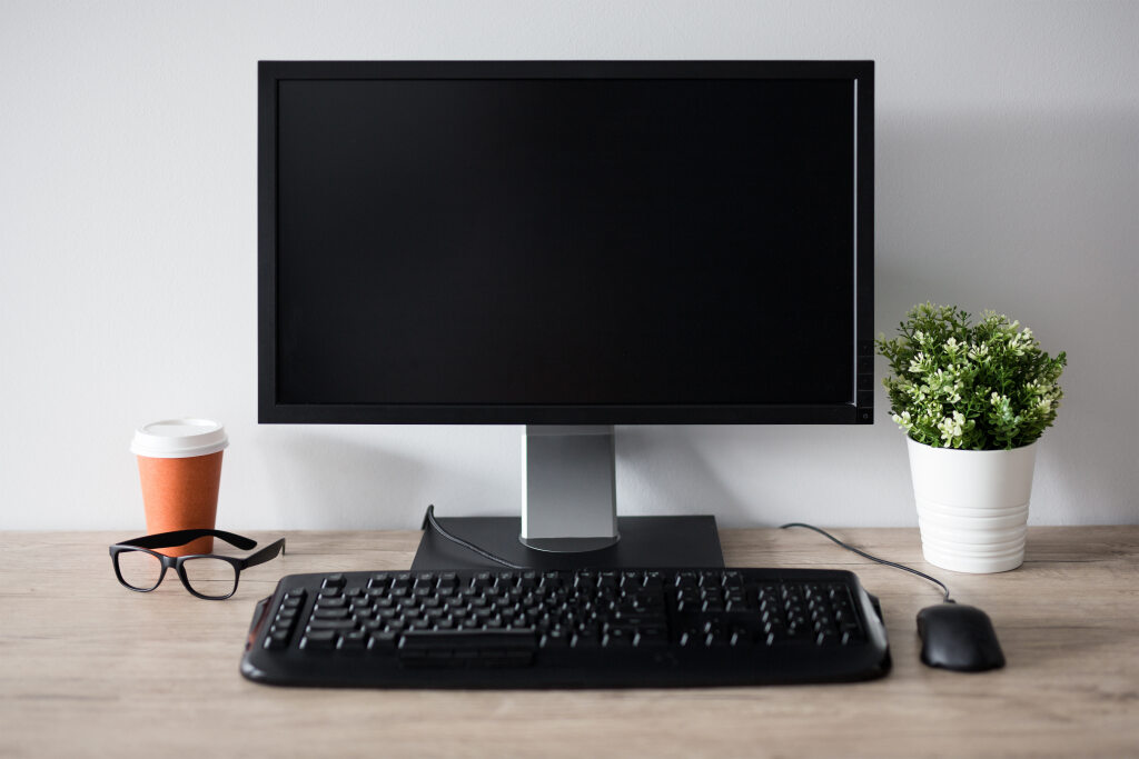 desk with monitor, keyboard mouse