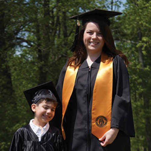 KSU graduate with their child